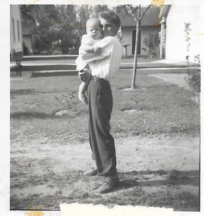 Irving Goeke holding Carol Goeke.jpeg